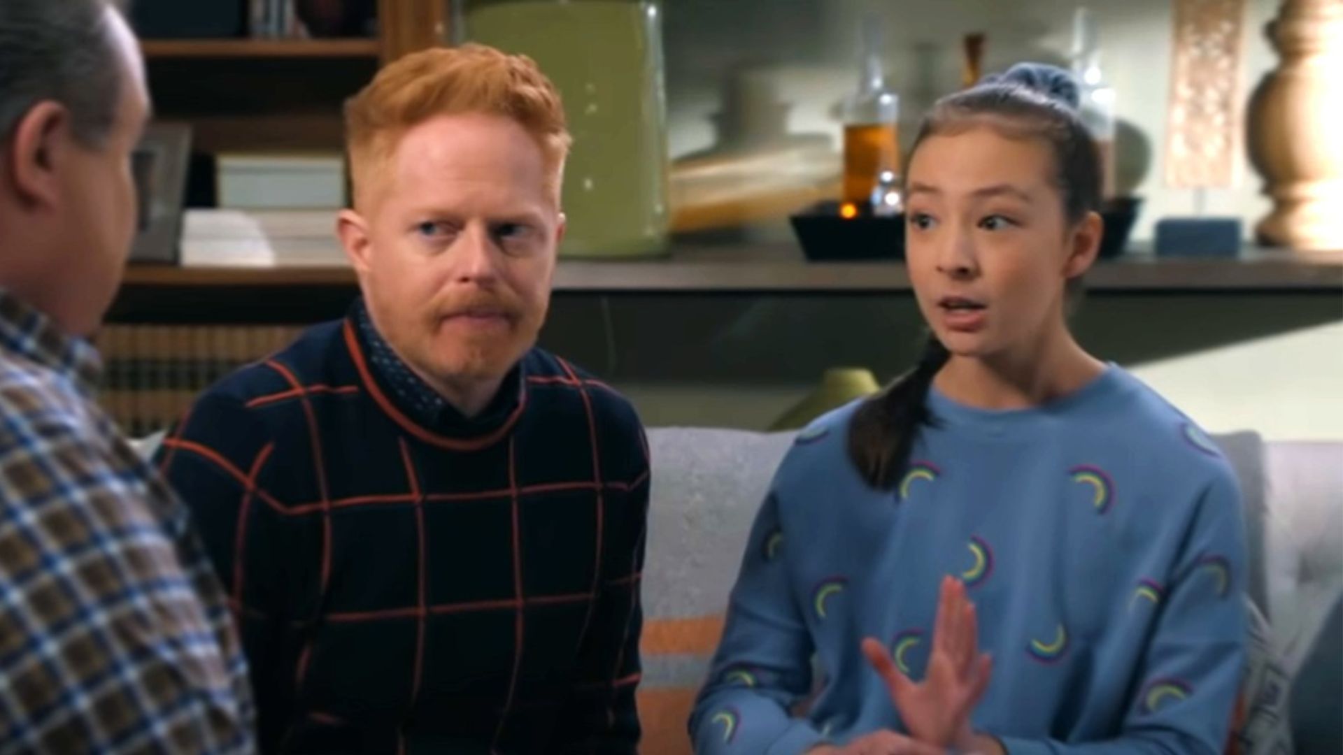 Lily and her adoptive parents in Modern Family (Image via ABC)