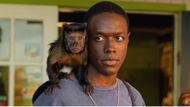 Ronald Peet and Crystal the Monkey as Neville Stafford and Driggs | Image Source: Apple TV