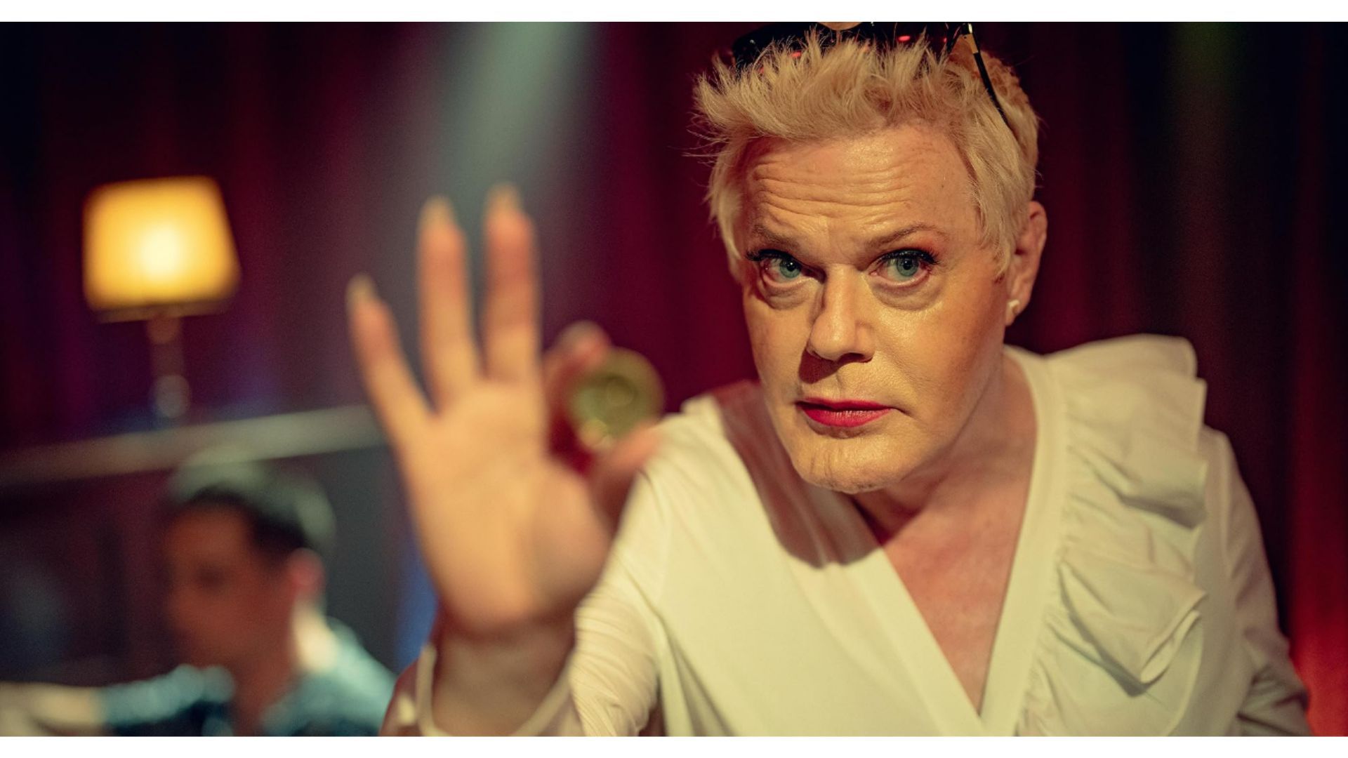 Suzy Eddie Izzard in KAOS (Image via Netflix)