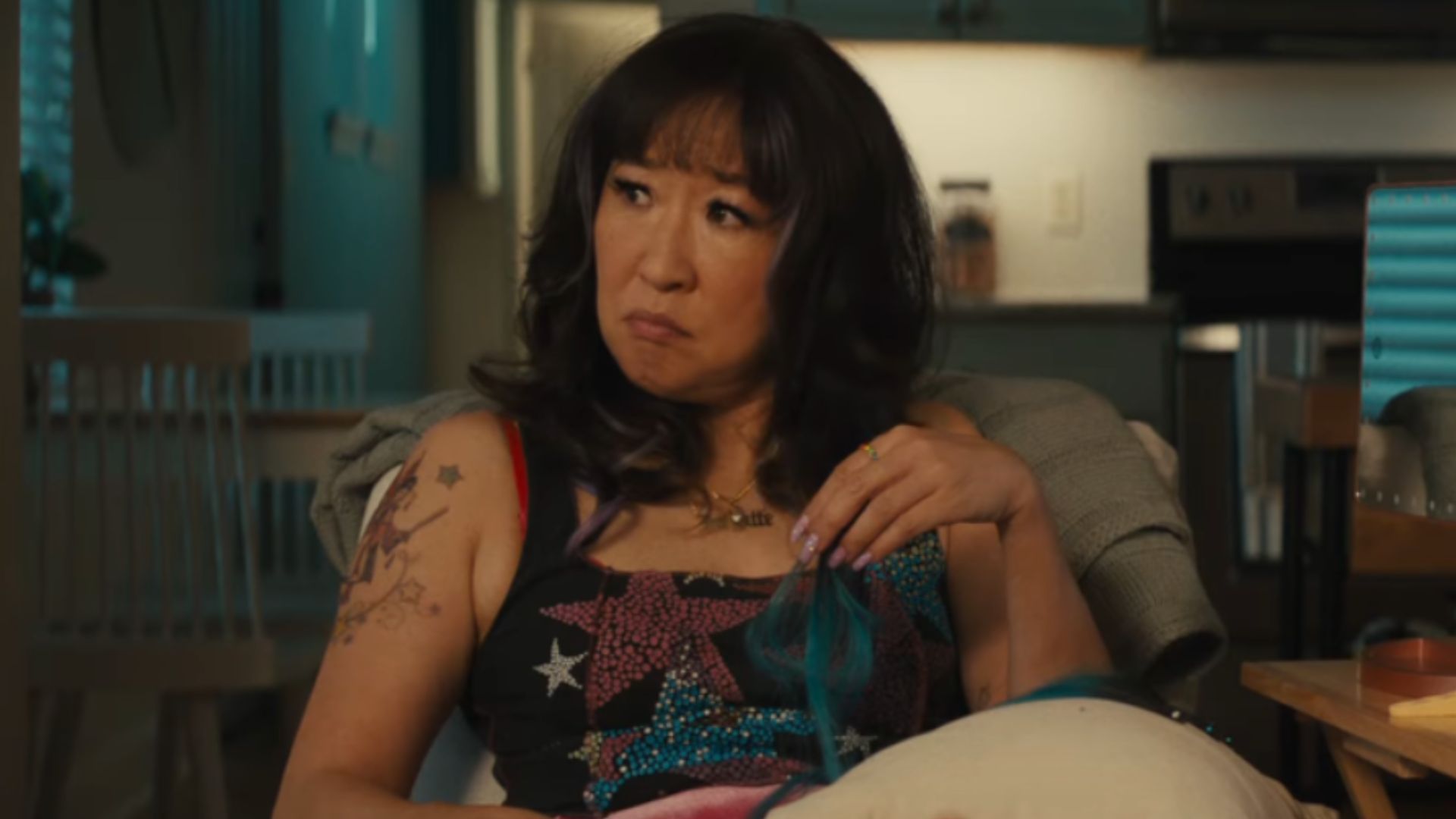 Sandra Oh from a still in the movie Quiz Lady | Image Source: Hulu