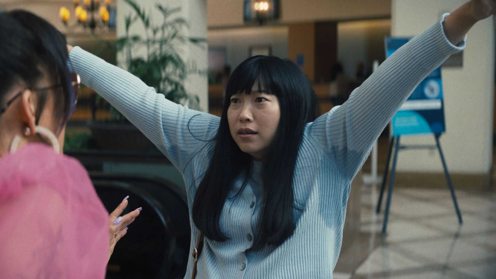 Awkwafina in a still from the movie Quiz Lady | Image Source: Hulu