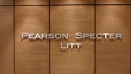 The name board reading 'Pearson Specter Litt' from Suits | Image Source: Netflix