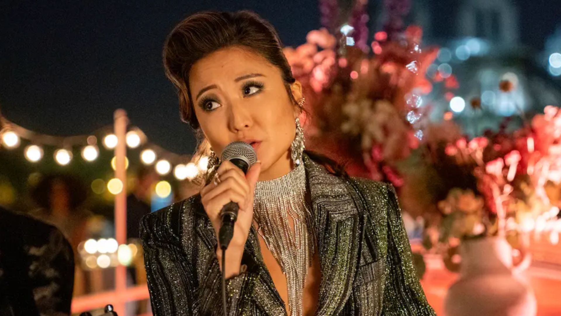 Mindy singing in Emily in Paris | Image Source: Netflix