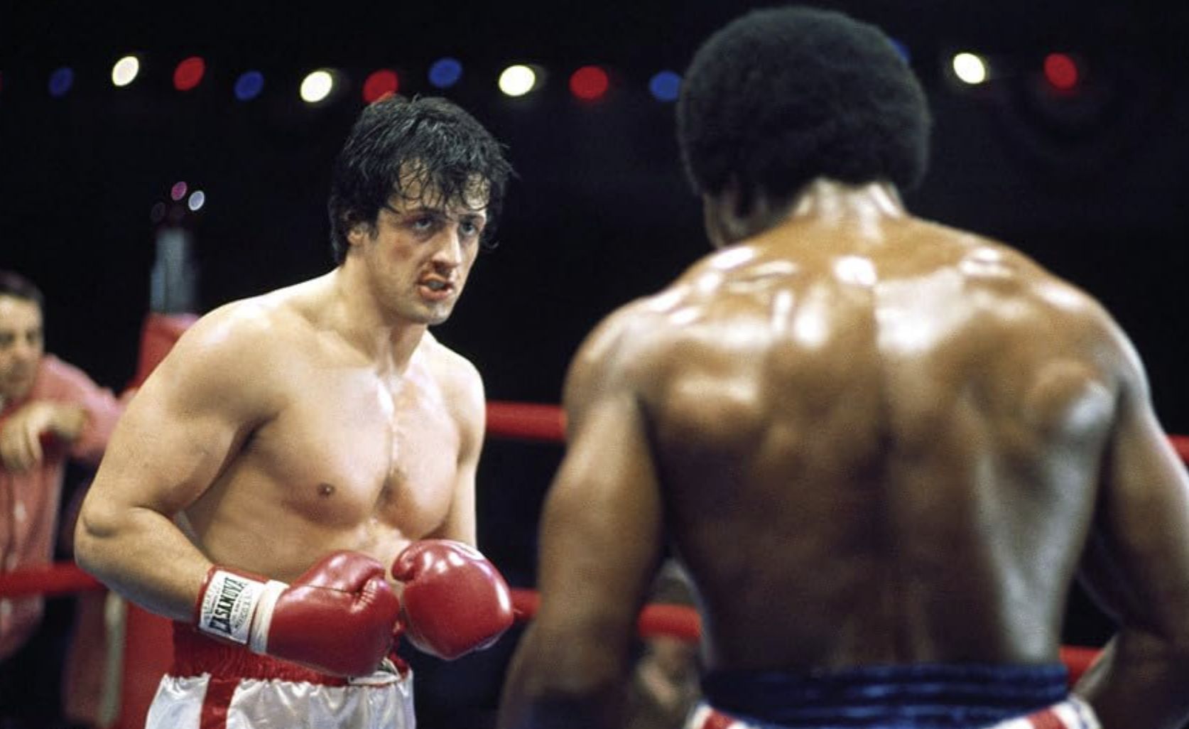 Sylvester Stallone and Carl Weathers in Rocky (Image via Metro-Goldwyn-Mayer Studios)