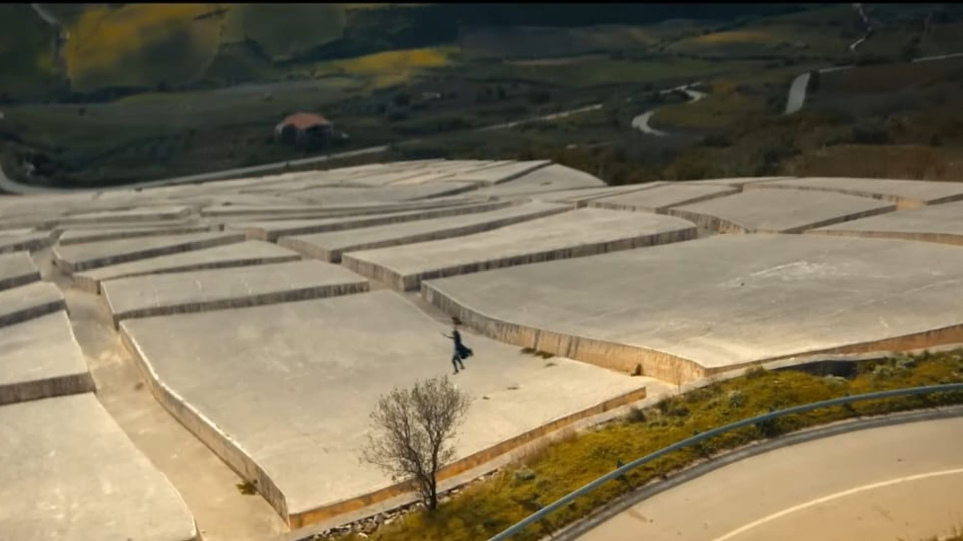 Diana zip lining and shooting over Cretto di Burri | Image Source: Amazon and MGM Studios