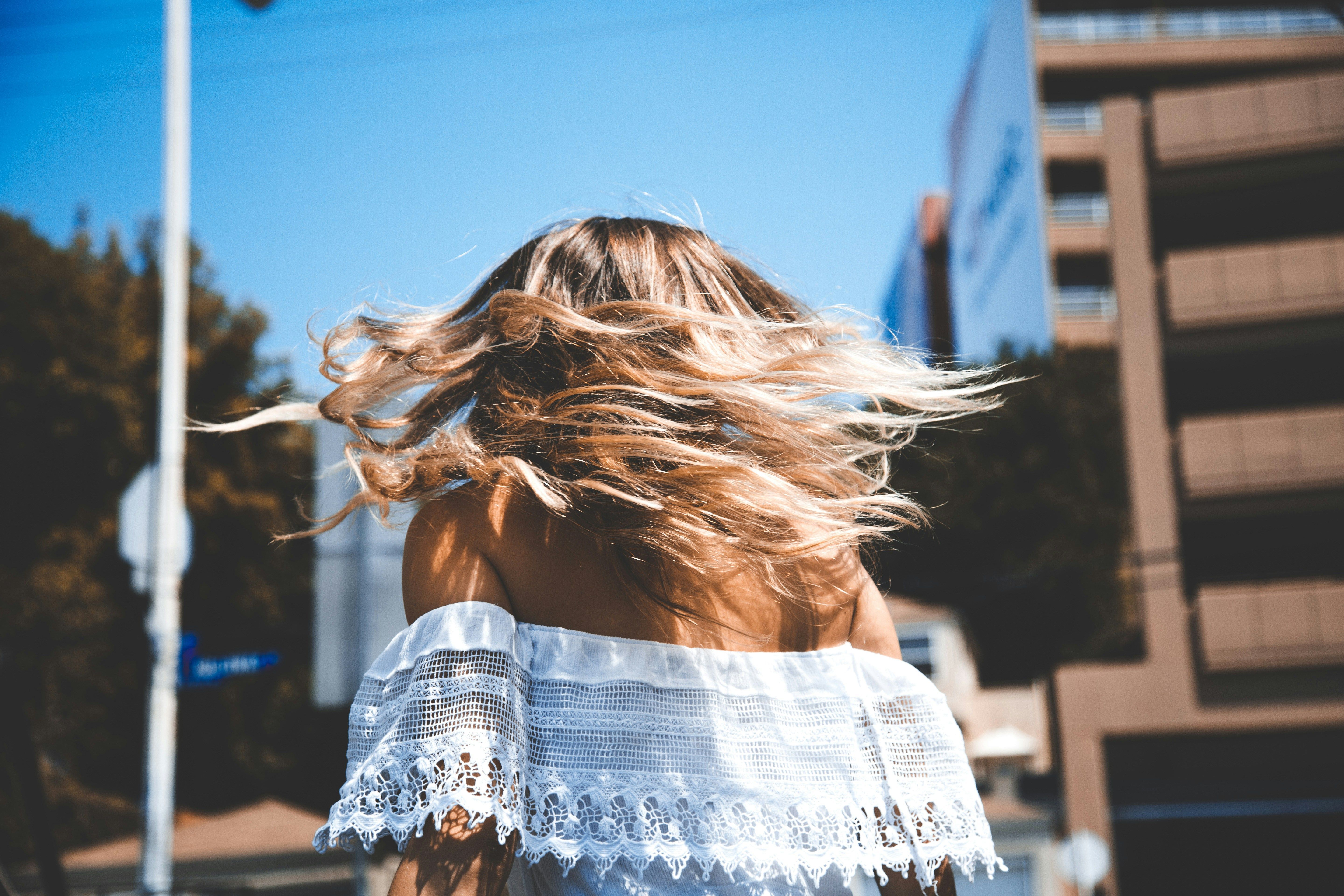 Choose shampoos that keep your hair healthy and happy (Image via Unsplash/ Maxx Miller)