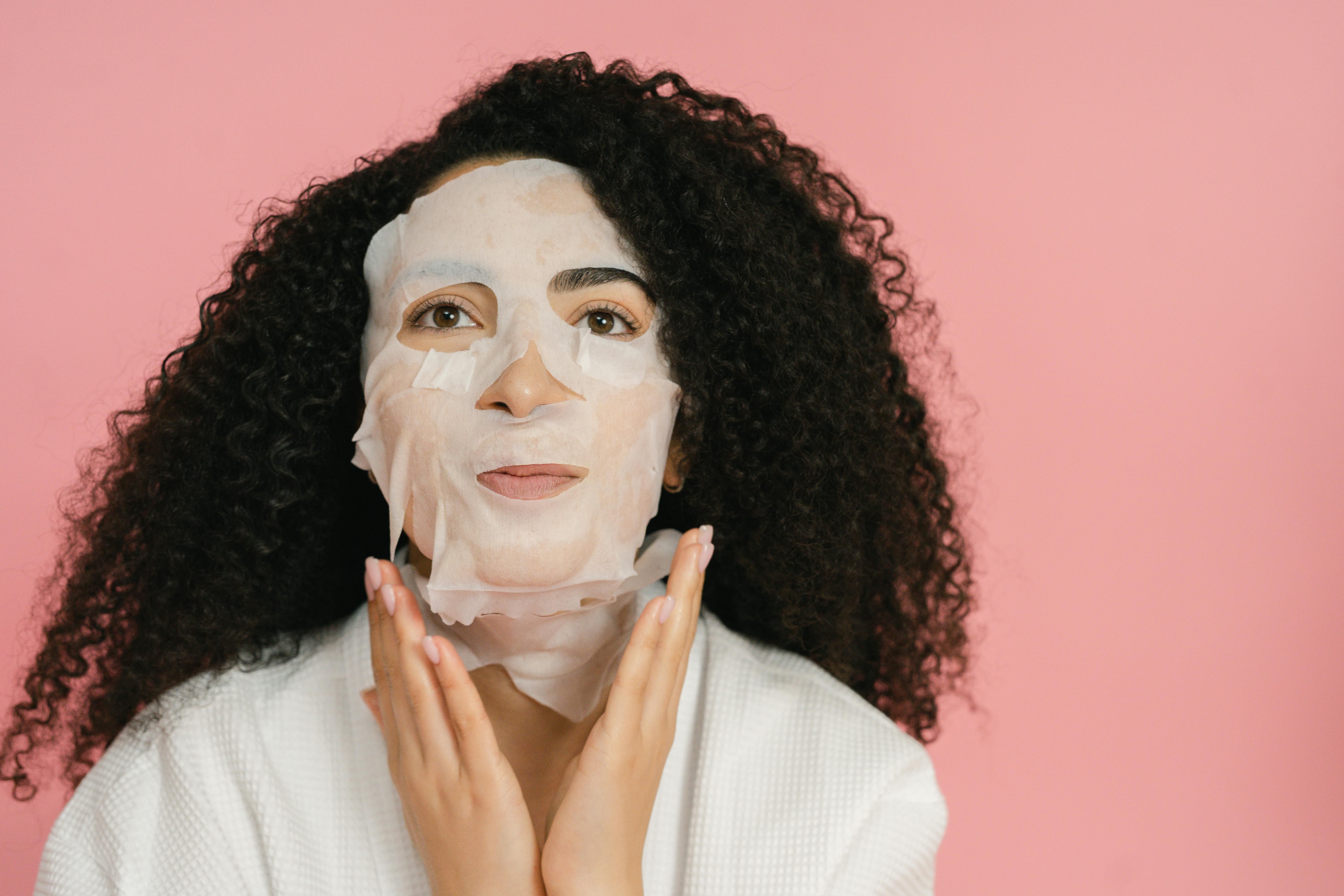 Sheet masks offer a cost-friendly and quick rejuvenation option (Image via Pexels/ Shvets Production)