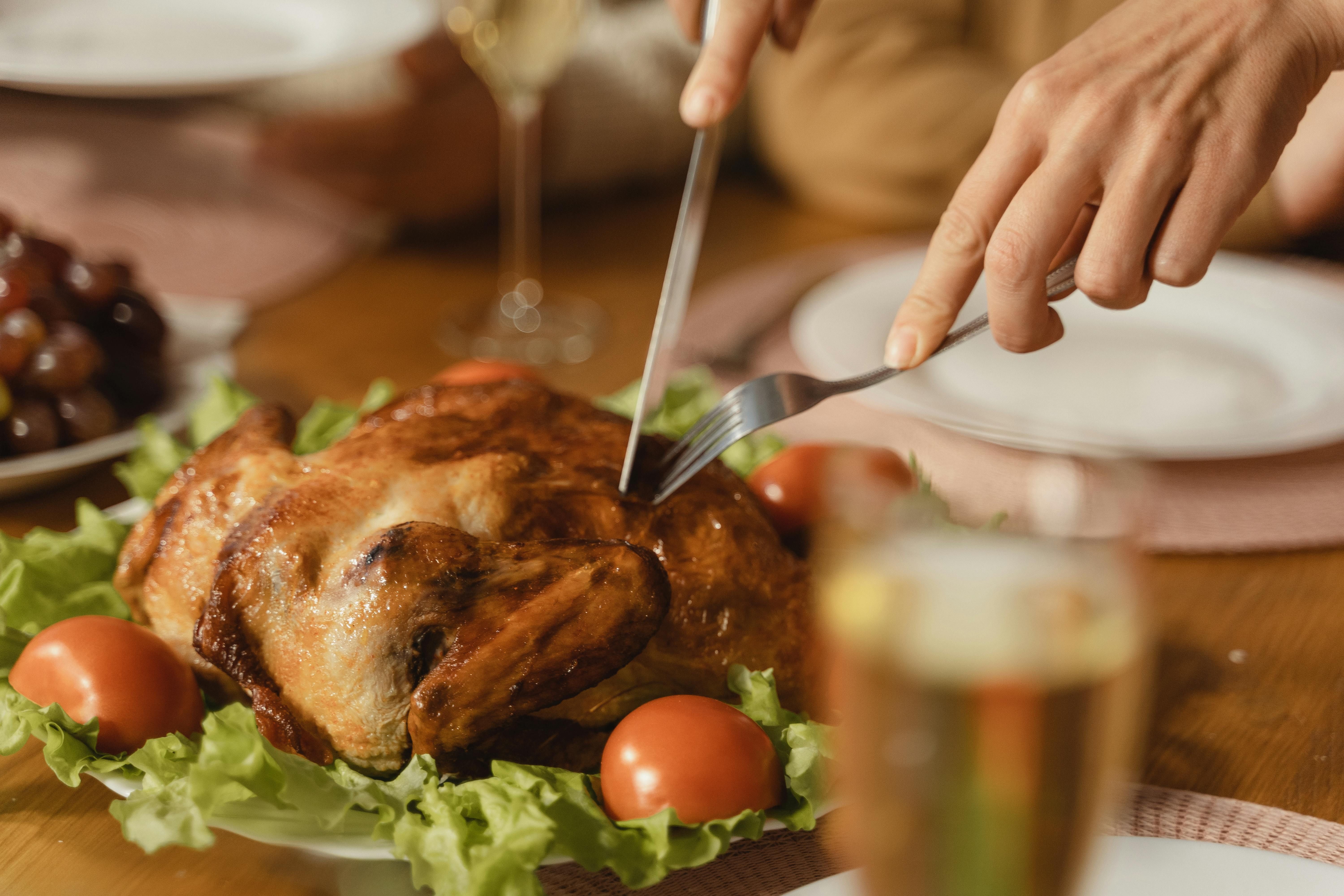 A Person Slicing Thanksgiving Turkey