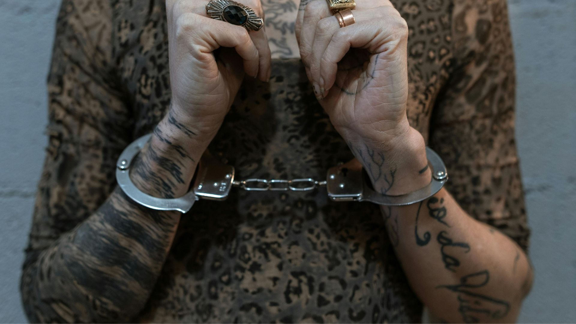 A handcuffed woman (Image via Pexels/RDNE Stock project)