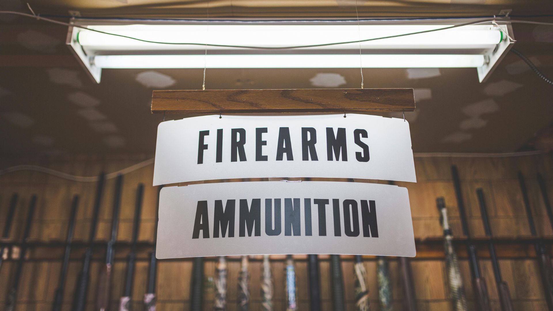 Firearms and ammunition sign (Image via Pexels / Stephen Andrews)