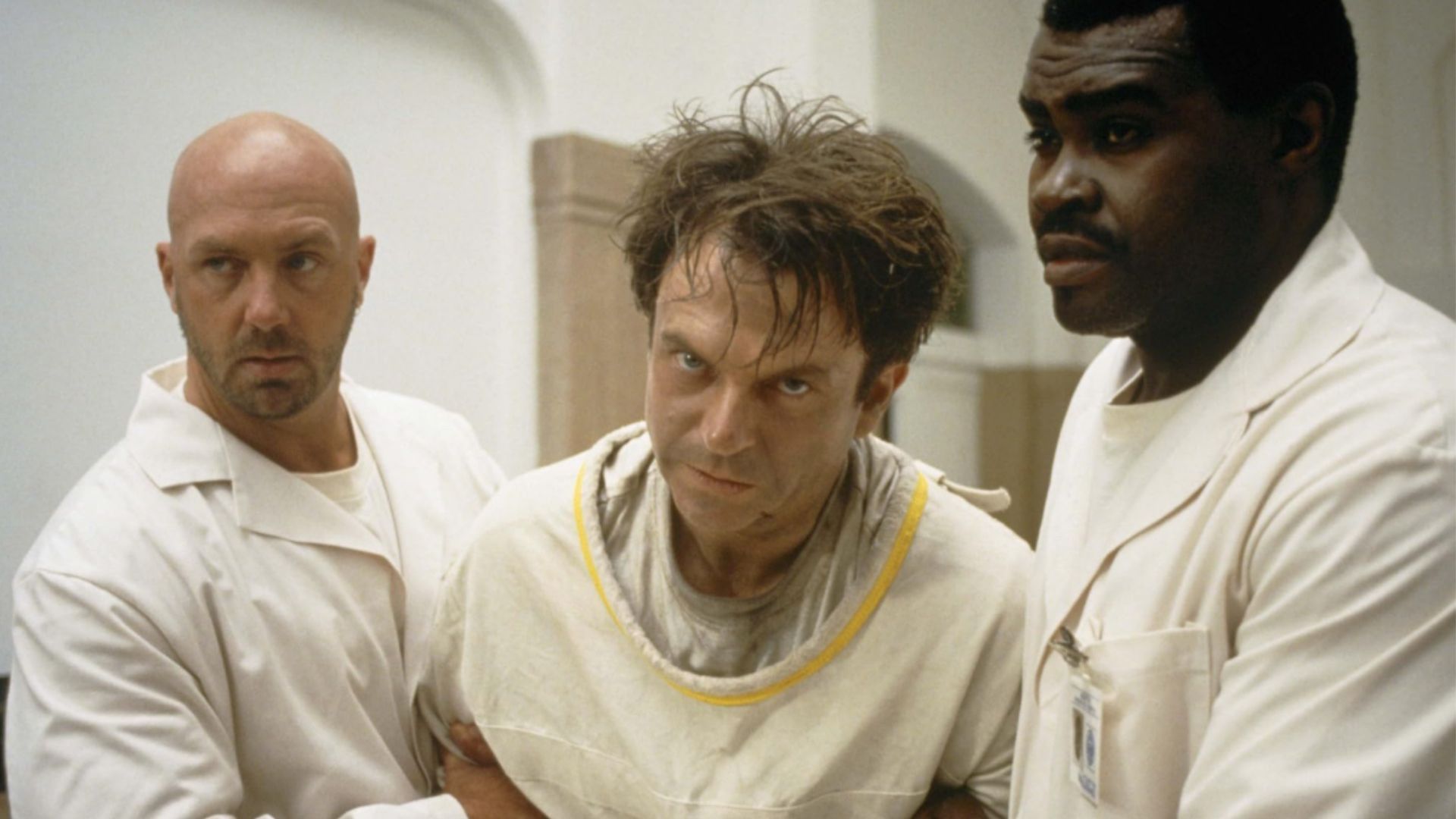 Sam Neill, Gene Mack, and Kevin Rushton in In the Mouth of Madness (Image via Prime Video)