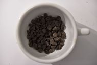 A cup of choco chips (Image via Getty)