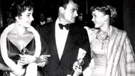 Elizabeth Taylor (left) with Mike Todd (middle) and Debbie Reynolds (right) (Image via Golden Globes)