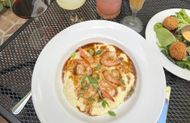Shrimp and Grits from Tujague’s. (Image via Instagram/@ tujagues_restaurant)