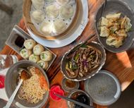 Pan-fried pork bao, Pork xiao long bao, Wonton with spicy sauce, Beef brisket noodles and Pig ear (Image via Instagram/@bitesizedtiff)