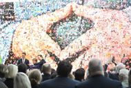 Angela Merkel's famous "Merkel-Raute" hand posture (Image via Roberto Pfeil/picture alliance via Getty Images)