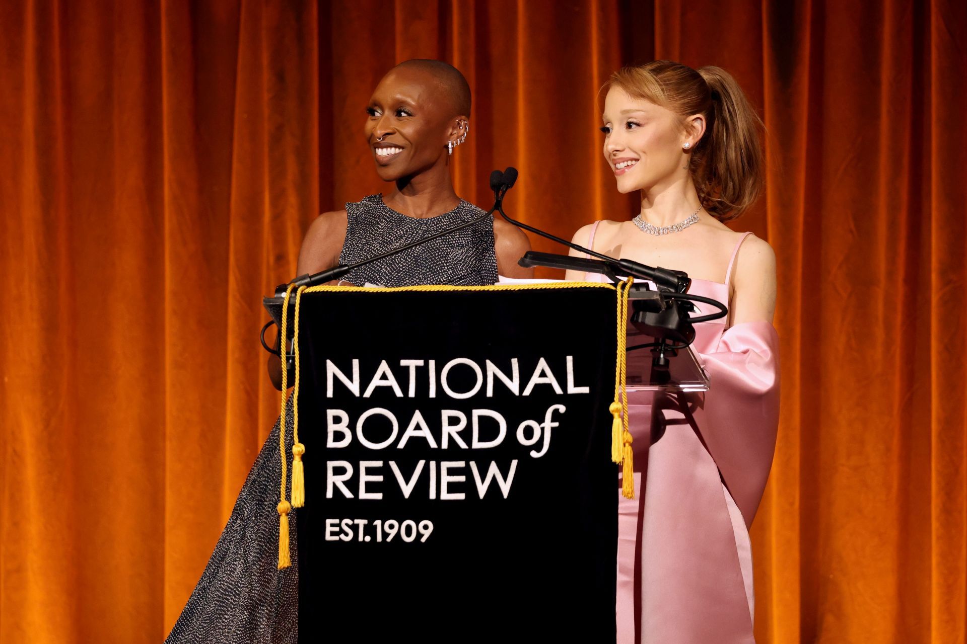 Cynthia Erivo and her Wicked co-star Ariana Grande accept the NBR Spotlight Award. (Image via Getty)