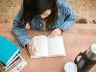 Reading a book (Image via Pexels)
