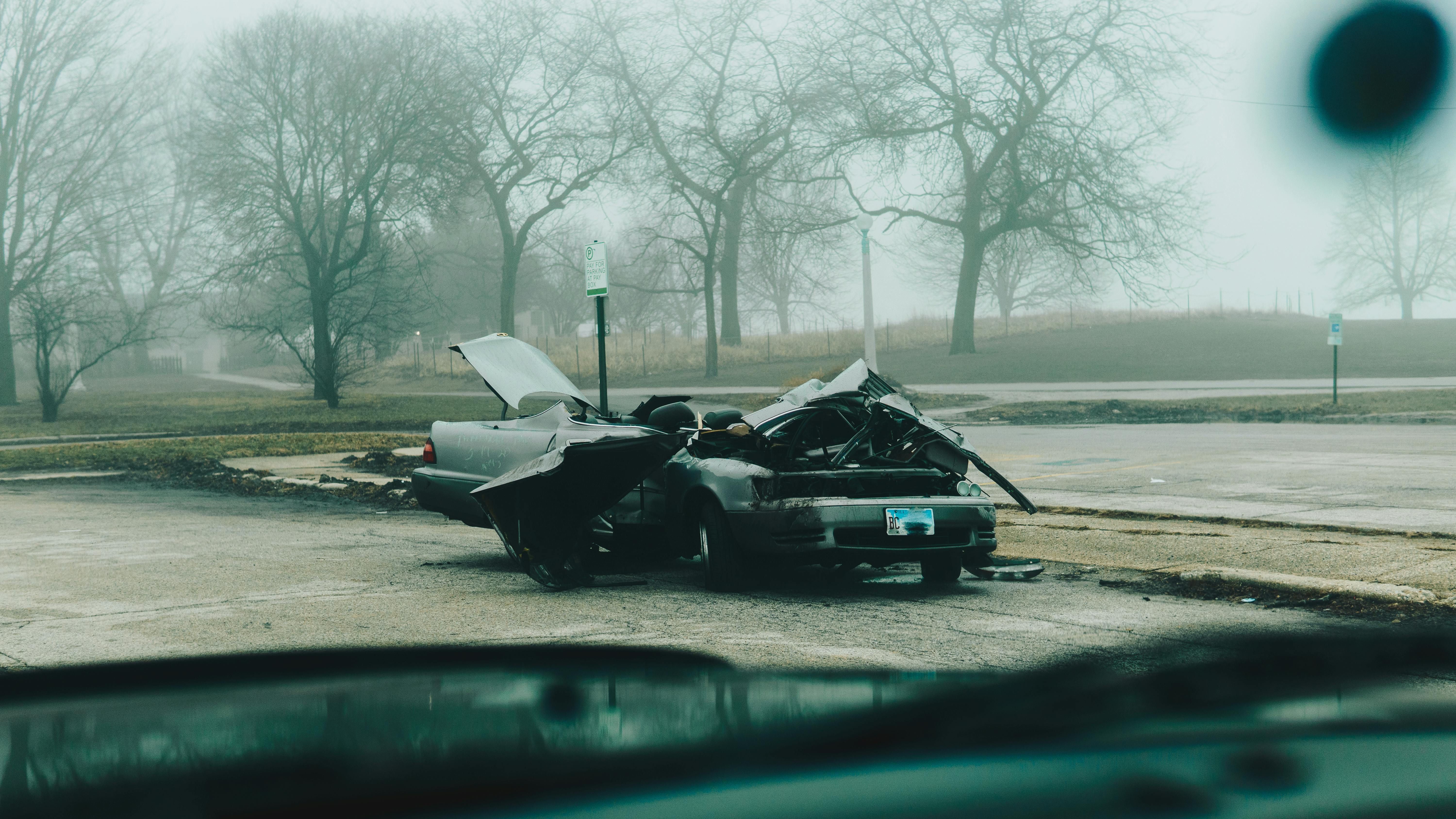 A Broken Car Parked Outside (Image via Pexels)