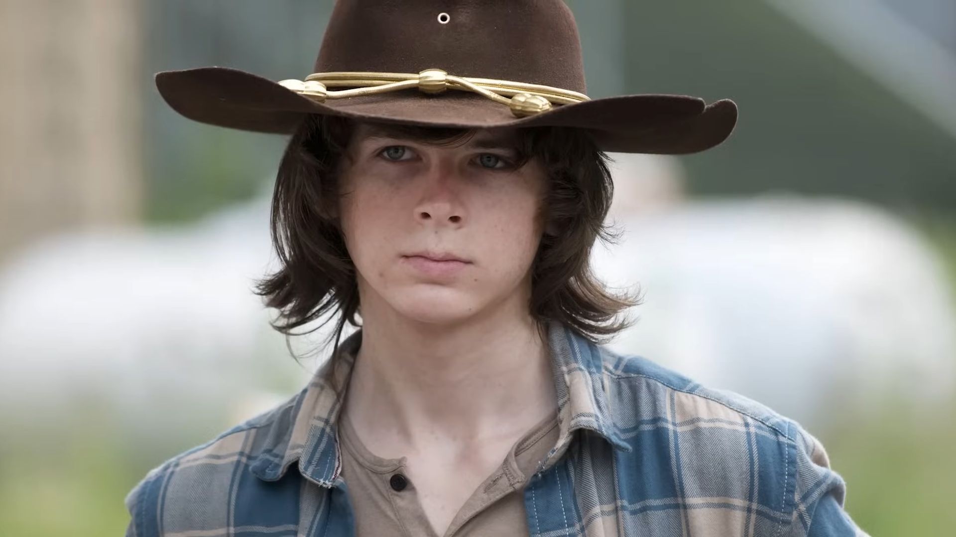 Chandler Riggs in The Walking Dead | Image via AMC Studios