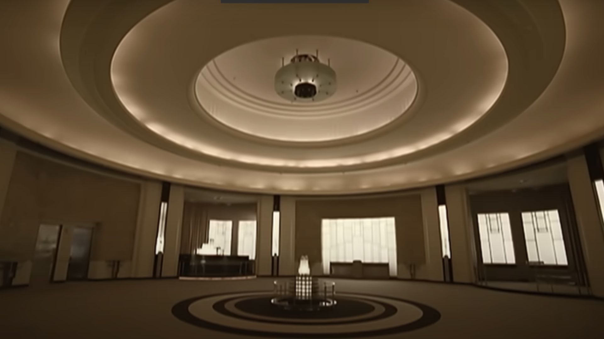 The empty reception and hotel lobby area are in the video. (Image via Youtube/Thirty Seconds to Mars)