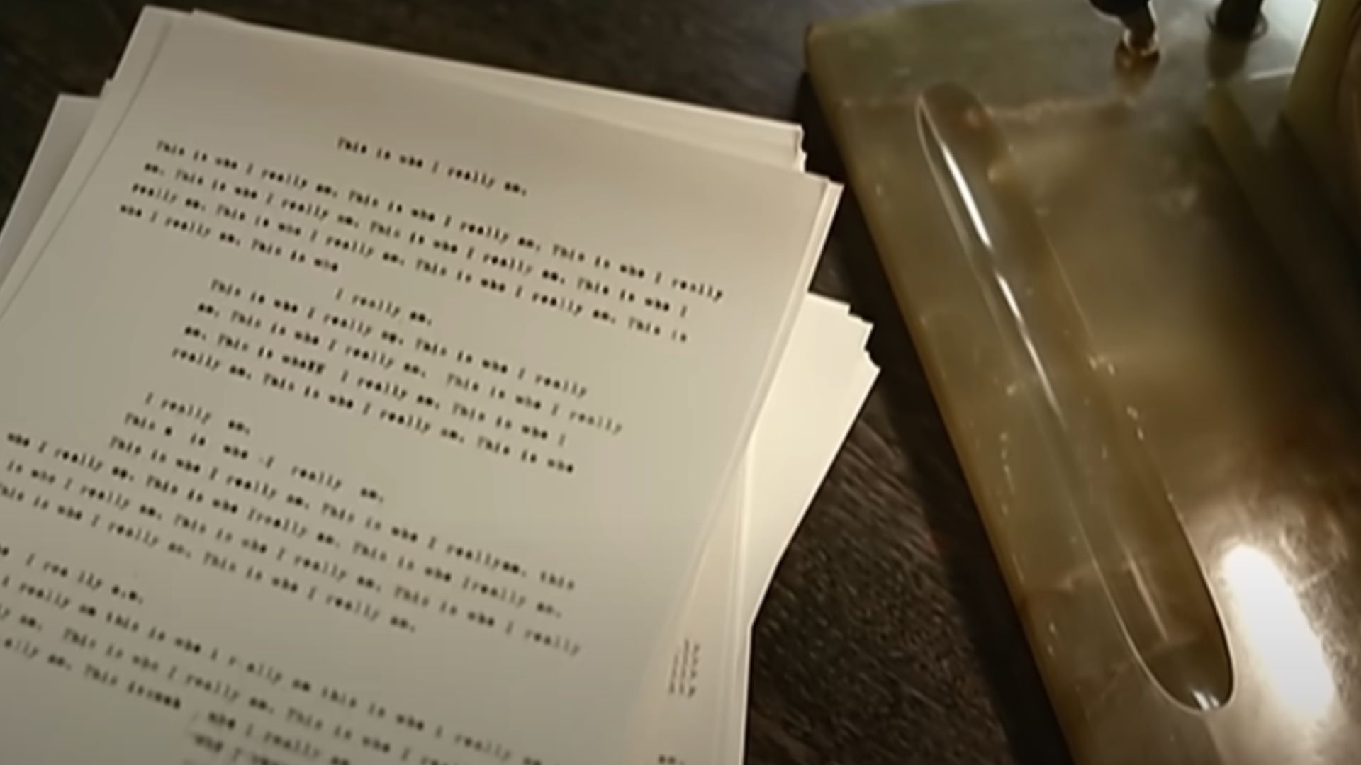 Still from the video&mdash;a bunch of paper with the same words printed. (Image via Youtube/Thirty Seconds to Mars)