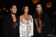 Kourtney Kardashian, Kim Kardashian and Kris Jenner at the Paris Fashion Week on October 2, 2016. (Image via Getty)