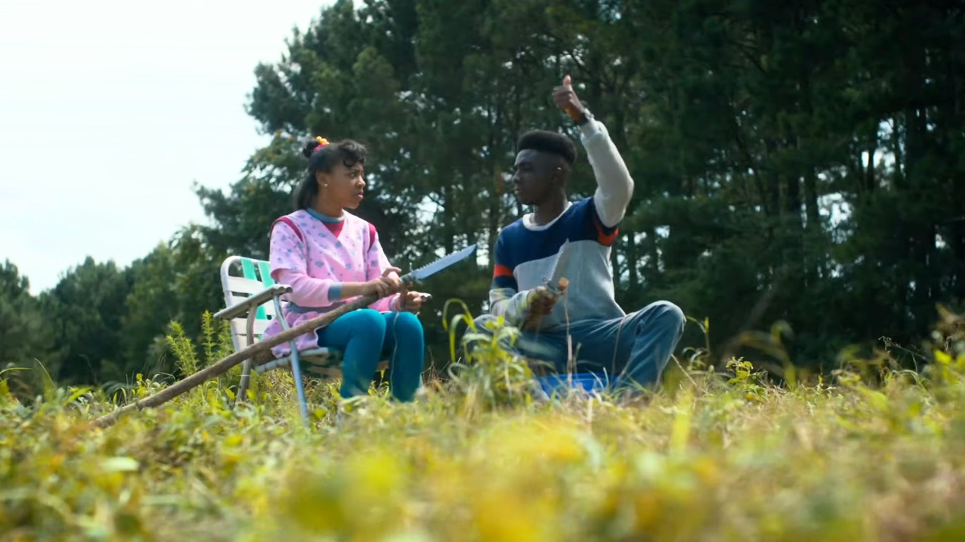 Priah Ferguson with Caleb McLaughlin in Starnger Things | Image via 21 Laps Entertainment