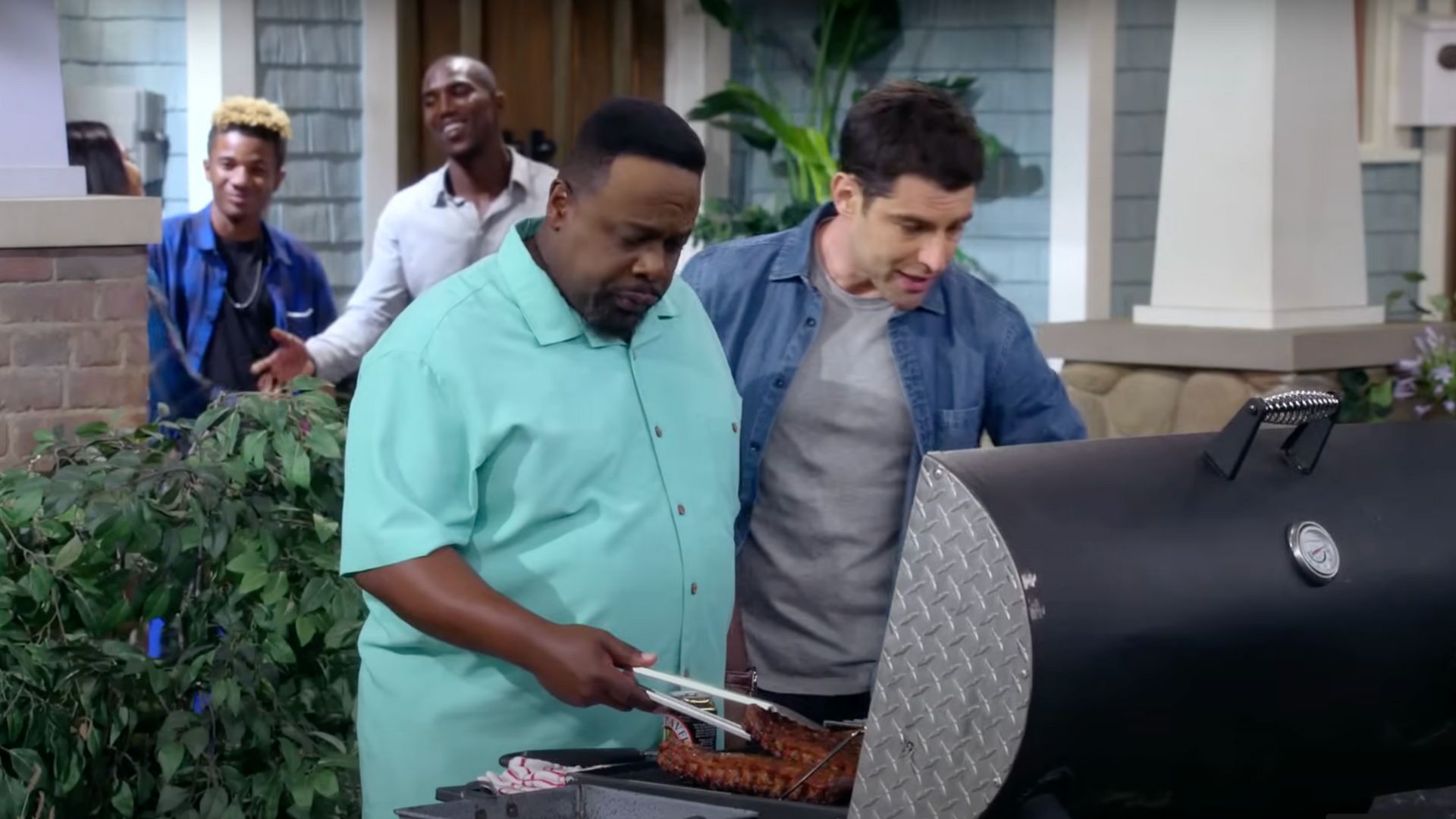 Cedric The Entertainer and Max Greenfield in The Neighborhood (Image via CBS/YouTube)