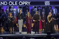 (L-R) Reba McEntire, Charles Kelley, Hillary Scott and Dave Haywood of Lady A, and Carrie Underwood during the Opry 100th Anniversary event. (Image via Getty)