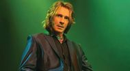 Rick Springfield play on Supernatural sitting image with green background