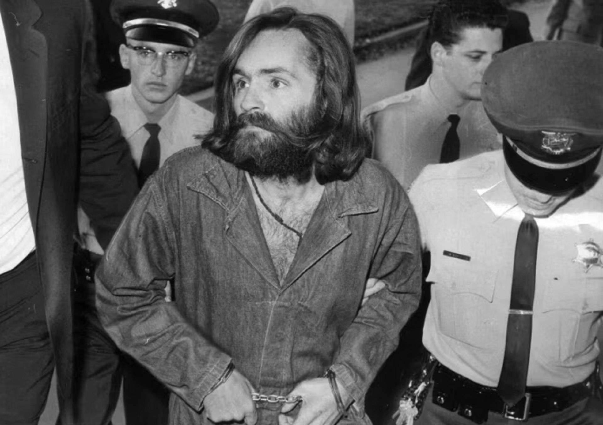 Charles Manson is escorted to a court hearing in 1969 &copy; John Malmin/Getty