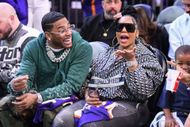 Nelly and Ashanti sit courtside during an NBA game in 2024. (Image via Getty)