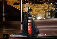 Carrie Underwood performs onstage during Opry 100: A Live Celebration. (Image via Getty)