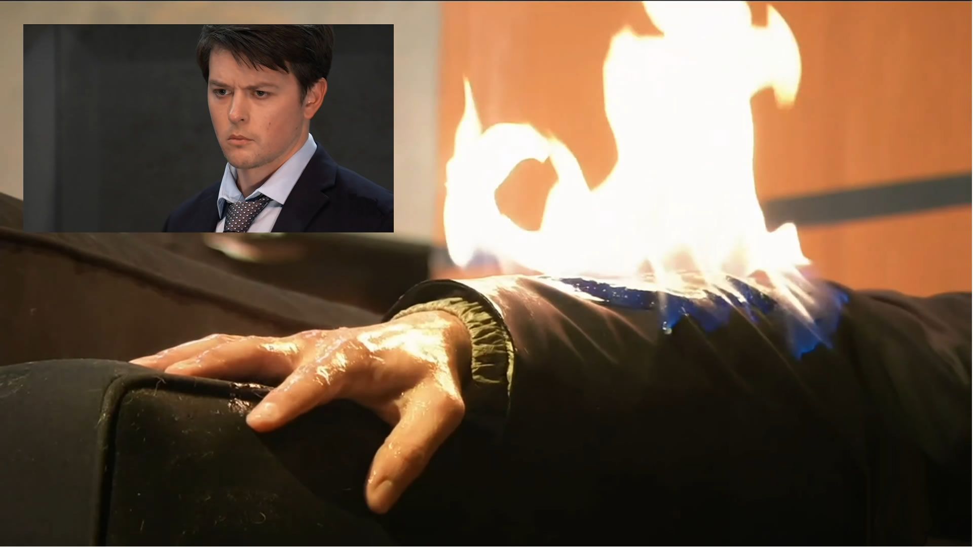 Michael&#039;s arm on fire with a close-up of him inset. | Image Source: YouTube