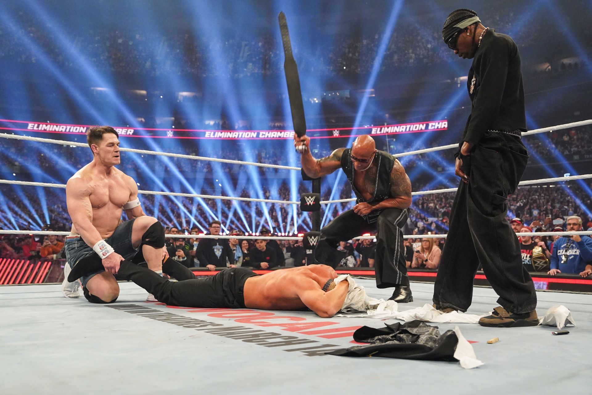 John Cena, Travis Scott, The Rock, and Cody Rhodes at WWE Elimination Chamber (Image via Getty)