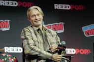 Mads Mikkelsen speaks onstage at The Hannibal Panel during New York Comic Con 2024 during The Jacob K. Javits Convention Center on October 20, 2024 in New York City. | Image via: Getty