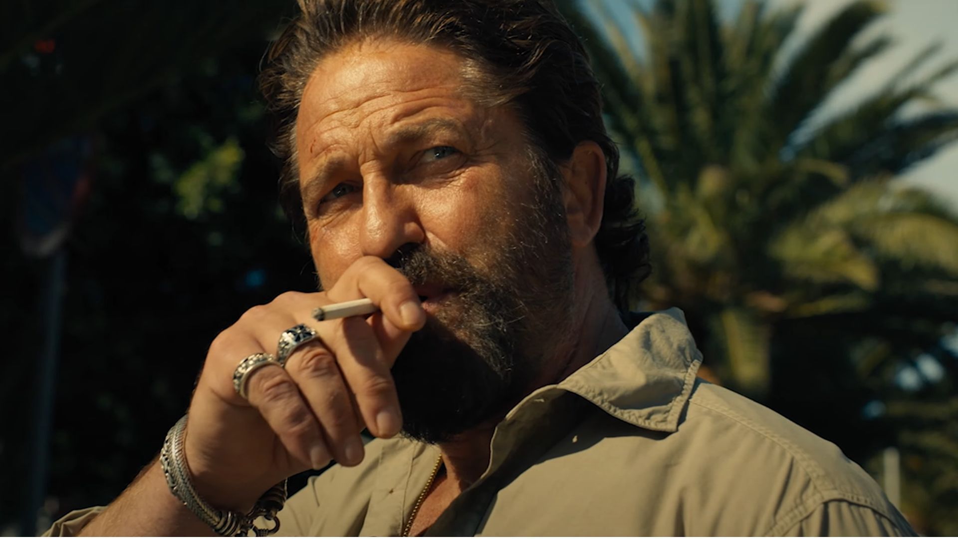 Gerard Butler as Big Nick, smoking a cigarette in Den of Thieves 2: Pantera