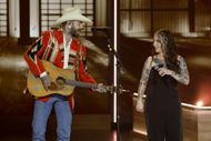 Post Malone and Ashley McBryde perform onstage during Opry 100: A Live Celebration. (Image via Getty)