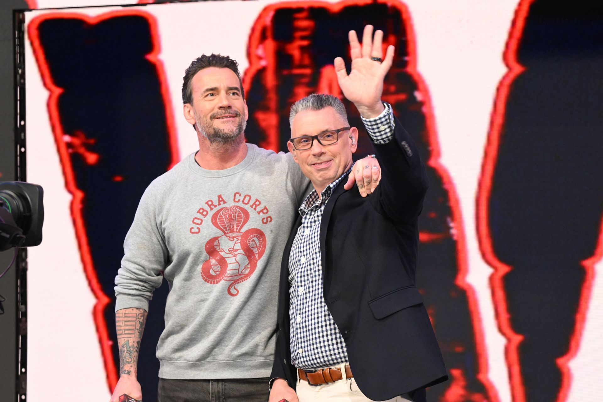 CM Punk with Michael Cole during The Elimination Chamber Kickoff Show. (Image via Getty)