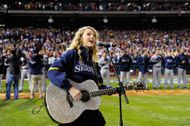 Taylor Swift performing the national anthem before game three of the 2008 MLB World Series (Image via Getty)