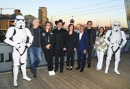 Tony Gilroy, Leslye Headland, Dave Filoni, Kathleen Kennedy, Mayor of London Sadiq Khan, Jon Favreau, and Sharmeen Obaid-Chinoy pose with Imperial Stormtroopers at the Star Wars Celebration Europe 2023 - Source: Getty