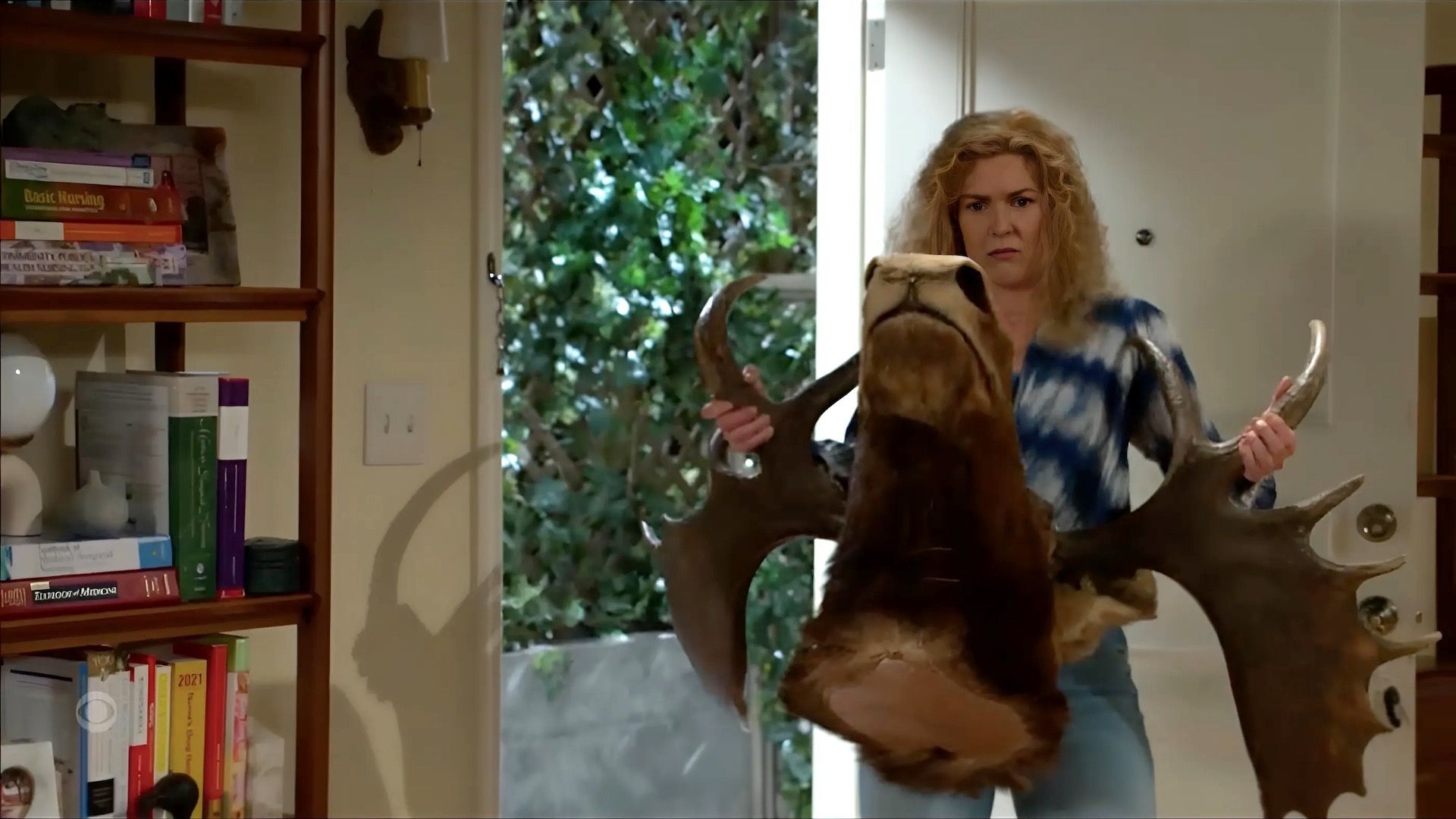 Jan brought the moose when Ashley and Derek got squirrelly about moving in together on Beyond the Gates | Image: CBS
