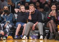 James Corden with his son at a game (Image via Getty)