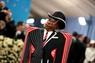 Janelle Monáe in a Thom Browne overcoat at The 2025 Met Gala (Image via Getty)