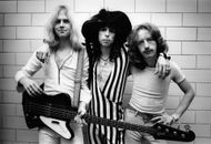 Photo of Steven TYLER, Tom HAMILTON, and Brad WHITFORD (Image via Getty)