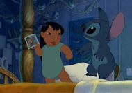 Stitch with Lilo holding her family photo
