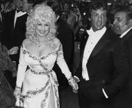 Dolly Parton And Sylvester Stallone Attend "Rhinestone" - Source: Getty