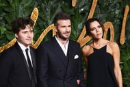 Brooklyn, David, and Victoria Beckham (Image via Getty)