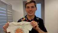 Max Verstappen with a shirt from Redbull as a present on announcement of the news of him and Kelly Piquet becoming parents.